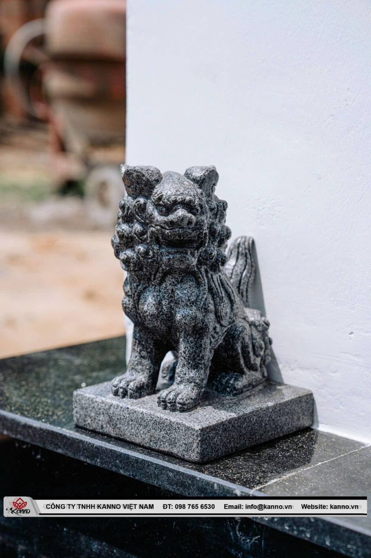 Stone Qilin statue at a memorial entrance 