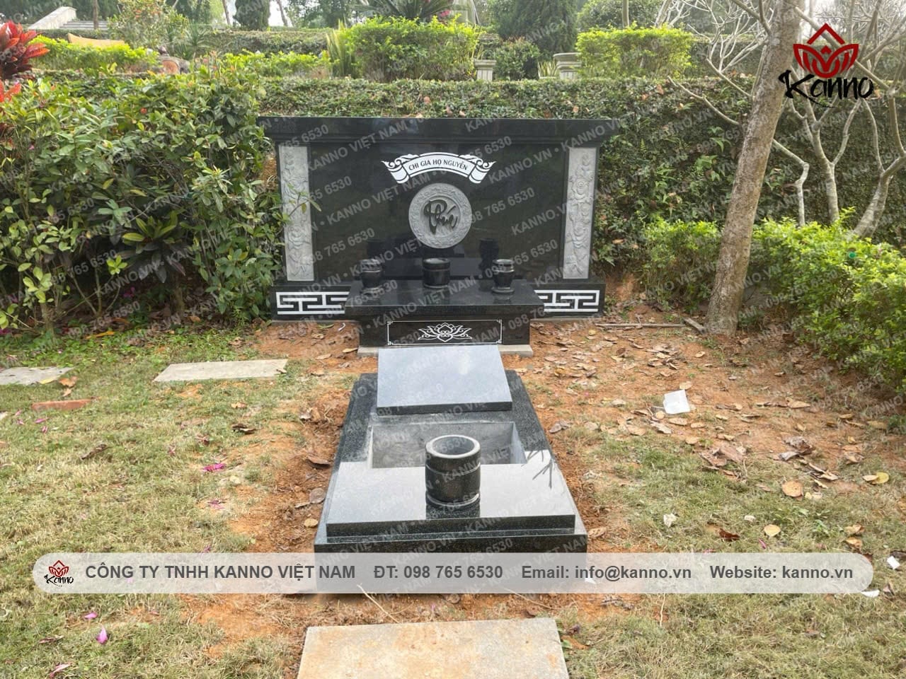 Thien Duc black granite stone scroll screen in a completed KANNO memorial garden